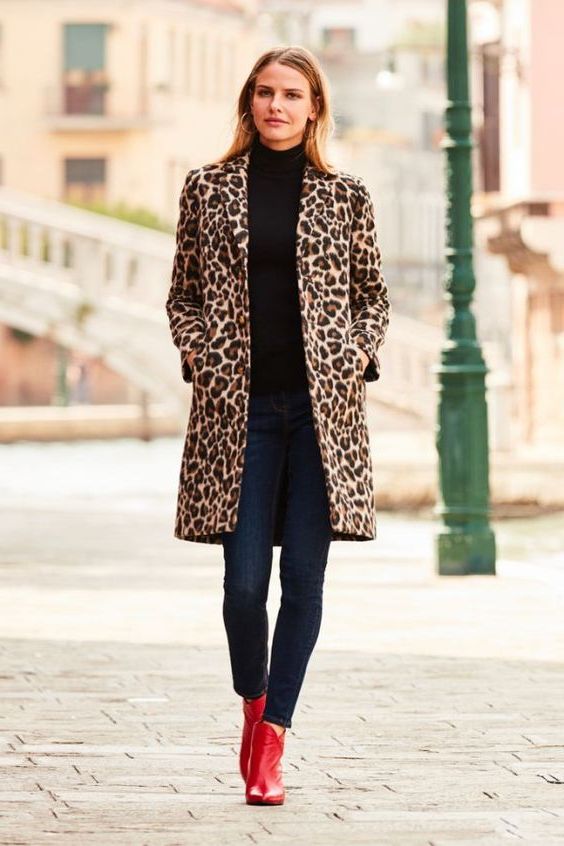 in a cheetah print coat